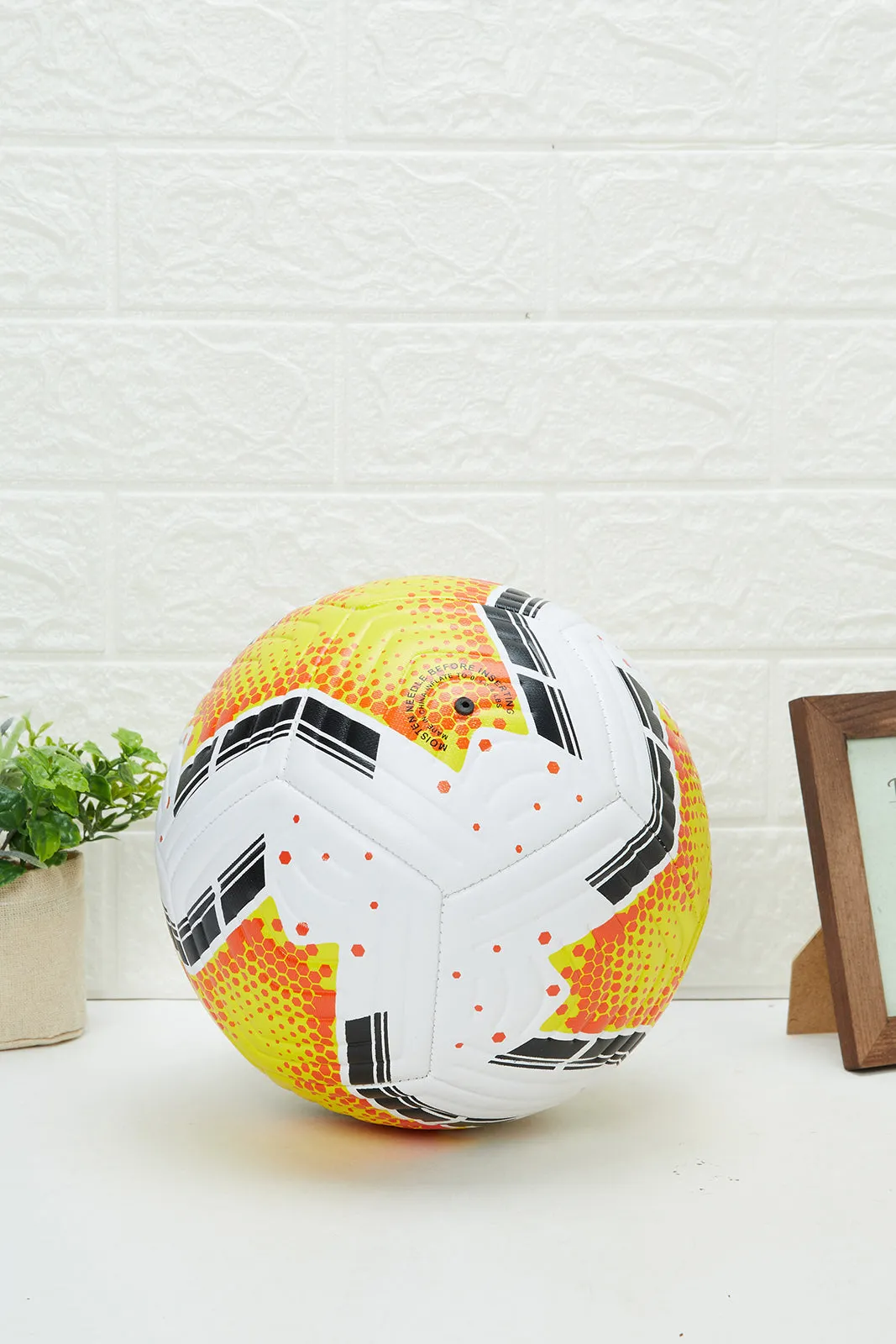 White And Yellow Printed Football